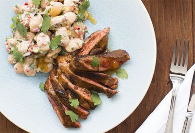 Butterfly leg of lamb with ras el haout and white bean salad