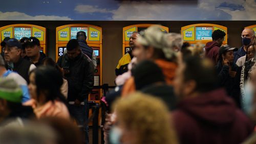 People wait in line at "The Lotto Store at Primm" just inside the California border Friday, Jan. 13, 2023, near Primm, Nev. Mega Millions players will have another chance Friday night to end months of losing and finally win a jackpot that has grown to $1.35 billion