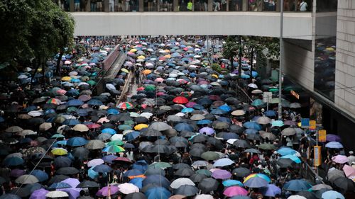 Millions of pro-democracy protesters march in central Hong Kong.