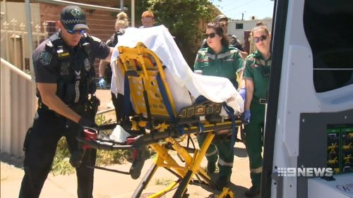 The 33-year-old man was taken away in a stretcher surrounded by police.