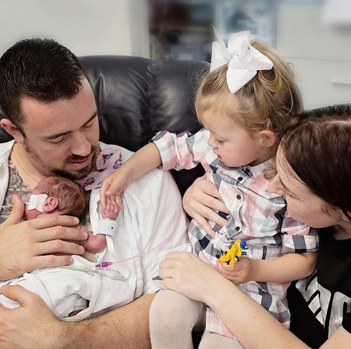 Baby Lorcan with his devoted family.