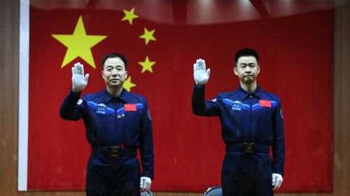 Chinese astronauts Jing Haipeng and Chen Dong. (AAP)