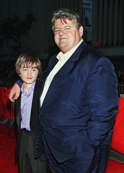 Daniel Radcliffe, left, who plays Harry Potter in the new movie "Harry Potter and the Sorcerer's Stone," and Robbie Coltrane, who plays Hagrid in the film, arrive for the film's New York premiere on Nov. 11, 2001. 