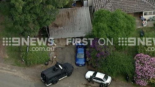 Police surrounded the property. (9NEWS)