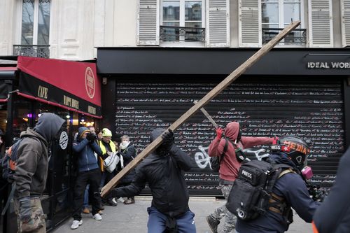 Railway workers invade Louis Vuitton HQ as protests erupt across France on  eve of decision on retirement age, World News