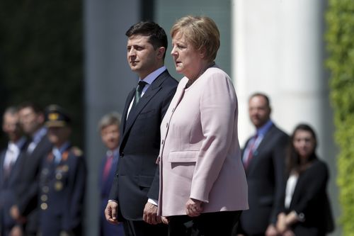 German Chancellor Angela Merkel appeared unwell, shaking as she met with the new Ukrainian president in Berlin.