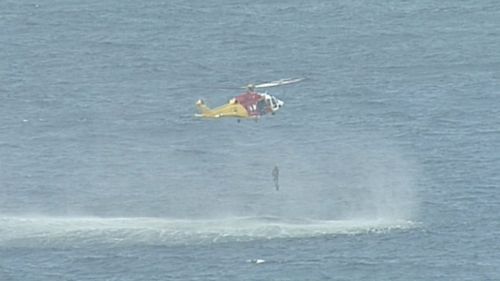 The two divers were lifted out of the water by helicopter after three hours missing.