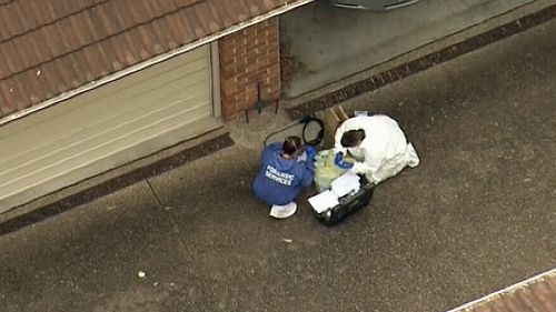 Police are investigating the woman's death, after the body was found in the unit block driveway