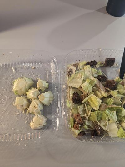 Customer shocked by the amount of inedible lettuce in his salad.