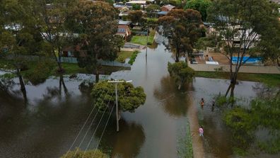 Flooded Howe Street in Mooroopna. 15 October 2022. The Age News. Photo: Eddie Jim.