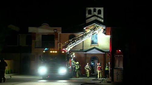 Leap of faith saves Melbourne priest from burning building