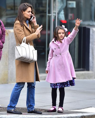 It's bow time - Suri Cruise and mum Katie Holmes in New York hailing a cab.