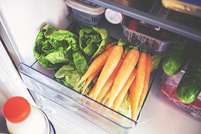 Fresh vegetables for storage in the fridge in a plastic box