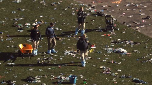 Investigators work among thousands of personal items at a festival grounds across the street from the Mandalay Bay Resort and Casino in Las Vegas. (AP)