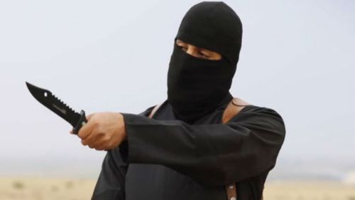 Jihadi John uses a knife threateningly in an ISIL video. (Supplied)