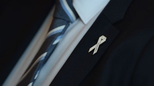 A White Ribbon pin. (AAP)