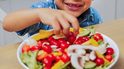 Child eating vegetables