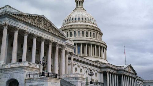 Congress has narrowly approved a stopgap measure to avoid the US defaulting on its debts.