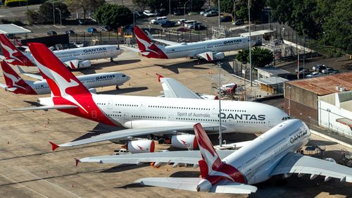 Qantas planes parked on the tarmac at Sydney Airport, in Australia. 