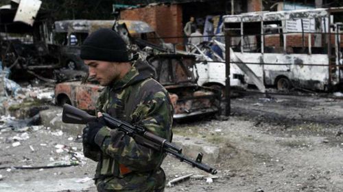 Kiev set to join EU, offers self-rule for eastern separatists