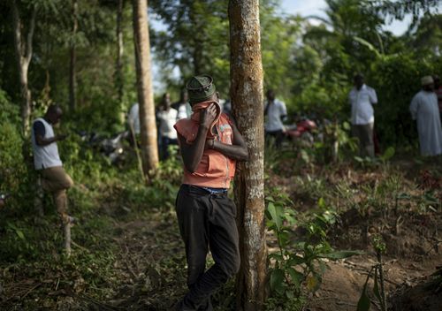 Ismael Kasereka, 14, weeps at the funeral of his uncle and aunt in Beni, Congo. Mussa Kathembo, an Islamic scholar who had prayed over those who were sick, and his wife, Asiya, died of Ebola.