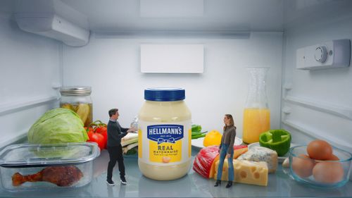 This photo provided by Hellmann's shows Jon Hamm and Brie Larson in scene from Hellmann's 2023 Super Bowl NFL football spot.
