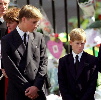 Prince William and Prince Harry stand outside Westminster Abbey at the funeral of Diana, Princess of Wales on September 6, 1997.