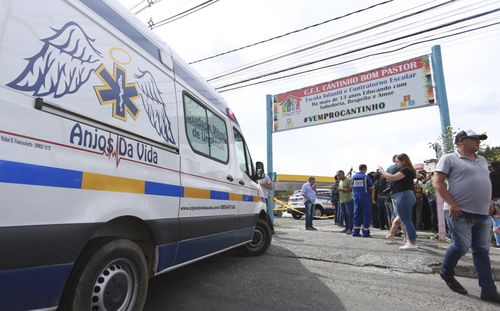 An ambulance is parked outside the private daycare center "Cantinho do Bom Pastor" after a fatal attack on children in Blumenau, Santa Catarina state, Brazil, Wednesday, April 5, 2023.