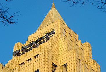 Which billionaire's holding company owns the Washington Post?