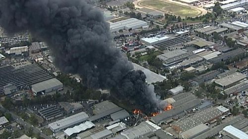 Smoke is affecting nearby Milperra Road, with the public advised to avoid the area. (9NEWS)