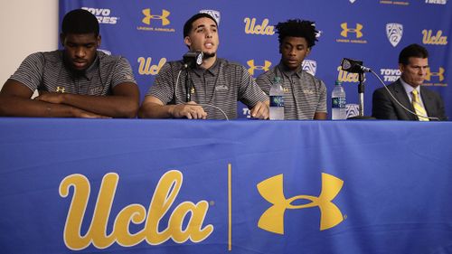 UCLA basketball playera Cody Riley, left,  LiAngelo Ball, center, and Jalen Hill during a news conference in LA. (AAP)