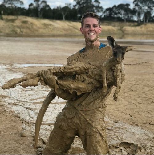 Nick Heath, 19, with the muddy roo. (Supplied)