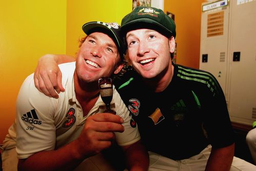 Shane Warne and Michael Clarke pose with a replica Ashes urn in 2006.