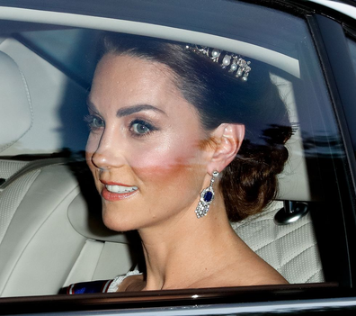 Kate, Duchess of Cambridge, arrives at Buckingham Palace for a gala dinner for US President Donald Trump on June 3, 2019, wearing sapphire and diamond earrings from the Queen Mother and the Queen Mary's Beloved Knot tiara.