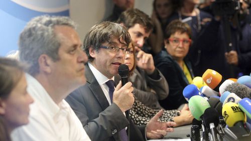 Mr Puigdemont, 55, is a former journalist and mayor of Girona who was thrust to the forefront of Catalonia's independence push. (PA/AAP)