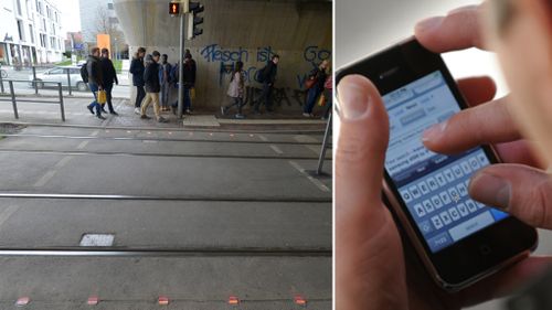 German city installs in-ground traffic lights so smartphone users don't have to look up