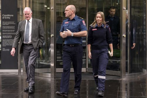 Paramedics Paul Judd (left), Mick Stephenson (middle) and Chenaye Bentley leave the County Court after Amanda Warren and Caris Underwood were spared jail for assaulting Judd in 2016. Victoria County Court, Melbourne, Australia, Tuesday, May 15, 2018. (AAP Image/Daniel Pockett) 