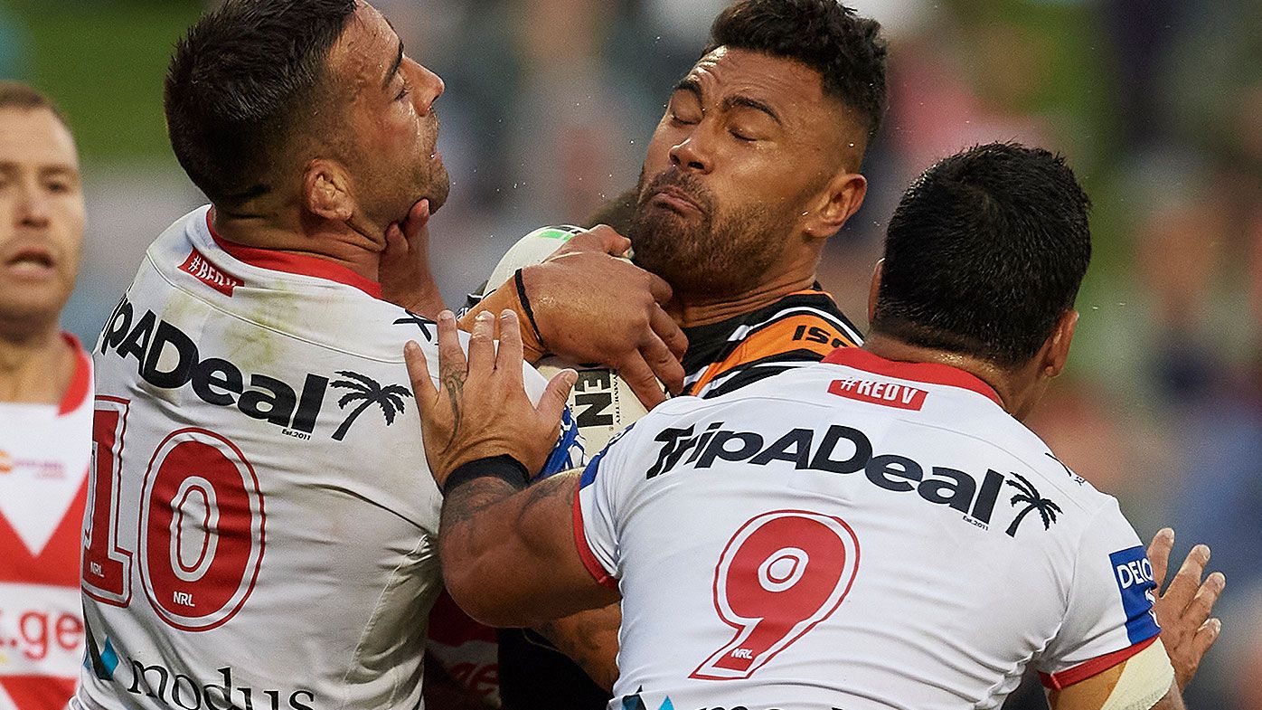 Zane Musgrove of the Tigers is tackled during the round 1 NRL match between the St George Illawarra Dragons and the Wests Tigers