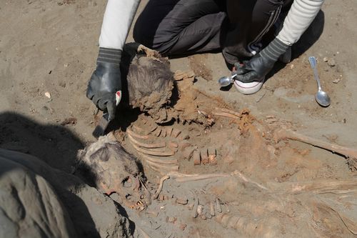 Archaeologists at an excavation in Peru.