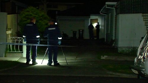 Police at the Civic Parade home.