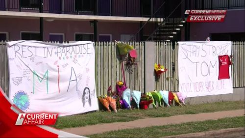 Flowers left out for slain friends Tom Jackson and Mia Ayliffe-Chung.