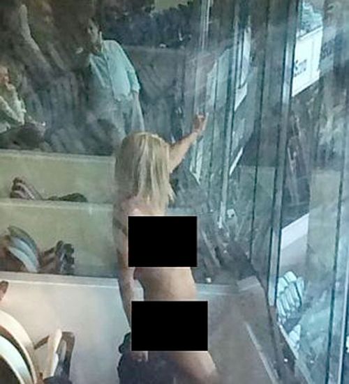 Photos circulate online of the naked antics in a corporate box at the AFL grand final. (Supplied)