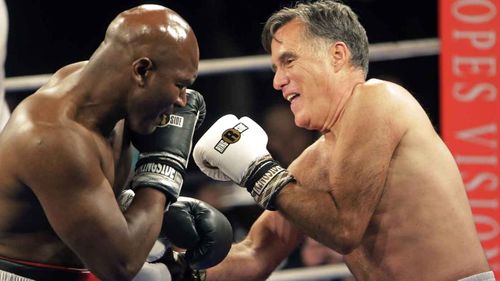Mitt Romney takes on Evander Holyfield in a charity fight. (AAP)