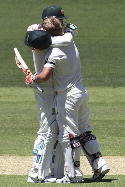 The captain embraced David Warner as the opener scored his century. (AAP)