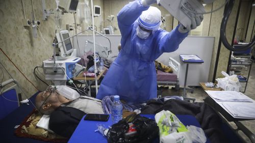 A medic works with corona patientsin a hospital in Idlib, Syria.