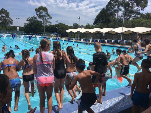 Kids dive into the pool at Ripples Penrith on the hottest December day on record. Picture: Laura Tunstall.