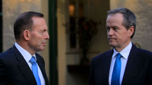 Tony Abbott and Bill Shorten - now set to be on the same side when it comes to asylum seekers. (AAP)