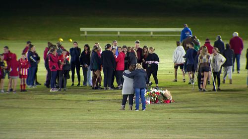 Community members gather at the Singleton Roosters football club following the horror Hunter Valley bus crash.