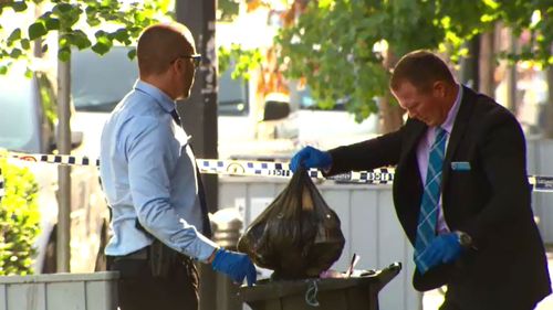 Investigators dig through bins in Bankstown. (9NEWS)