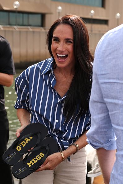 Meghan, Duchess of Sussex is presented with custom thongs which reads "G'Day Megs" by Invictus Australia veteran Joel Vanderzwan at the Sydney Opera House on April 17, 2026 in Sydney, Australia. 